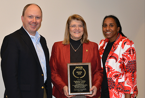 Shown L to R: Drs. David Rogers and Stephanie Phelps and UTCOP Dean Chisholm-Burns