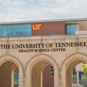 Photo of campus arches with dental building behind
