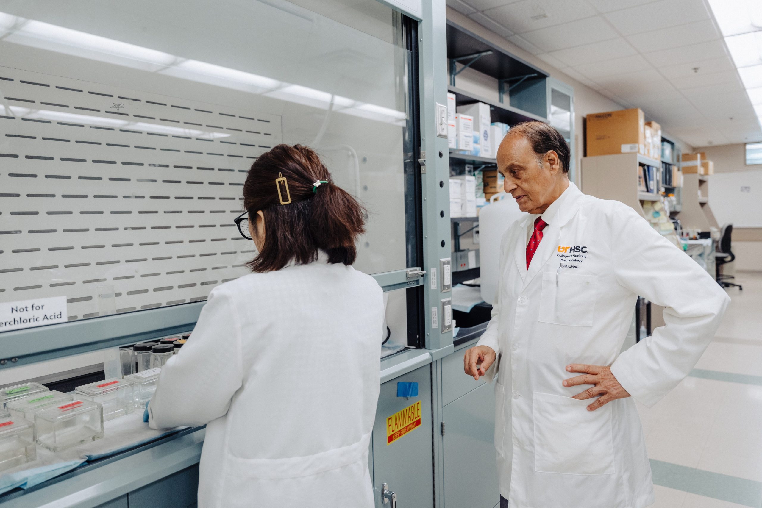 Photo of Dr. Kafait Malik and a trainee in the lab