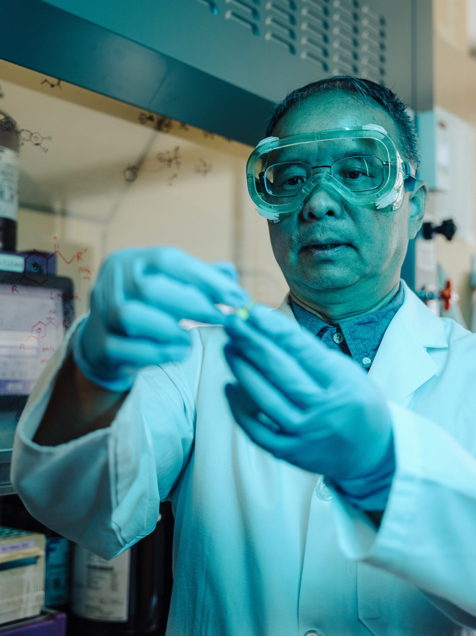 Photo of Dr. Wei Lei working in the lab