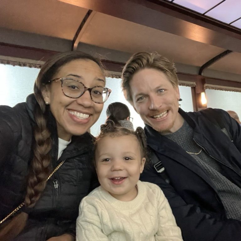 Dr. Burroughs-Ray with her husband daughter.