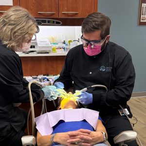 Dr. Cutshaw providing patient care alongside a colleague