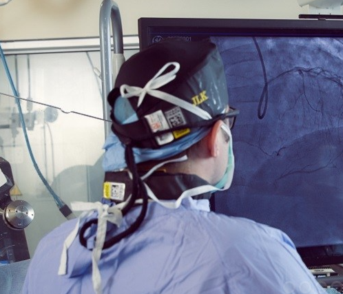 Dr. Jimmy Kerrigan looking at a real-time image while doing a heart catheterization