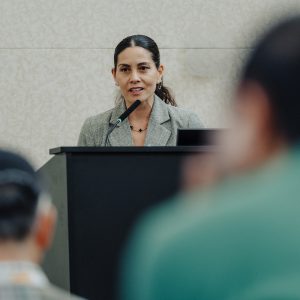 Dr. Jasmine Plummer speaking at a podium