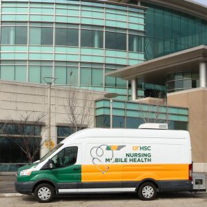 A Nursing Mobile Health van parked in front of Hooks Library