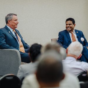Left, College of Medicine Executive Dean Michael Hocker and, right, Executive Vice Chancellor Raaj Kurapati address a campus town hall.