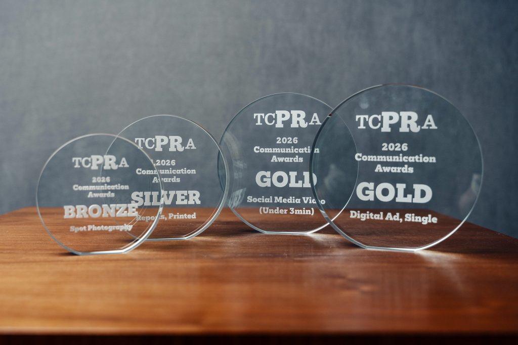 The four awards displayed on a table
