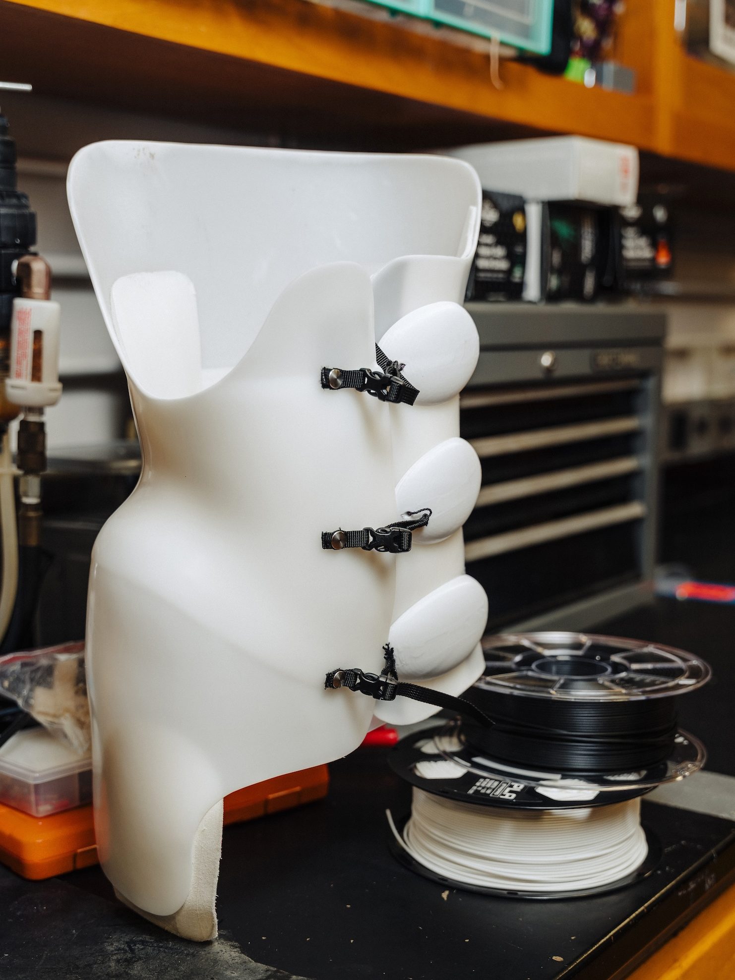 A scoliosis brace on a lab counter