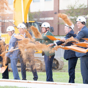 Local, state and university leaders partaking in a ceremonial shovel turn.